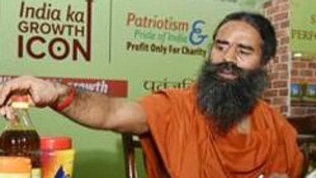 Yoga guru Ramdev’s Patanjali Ayurveda’s blamed an Uttarakhand government department after the company’s amla juice failed to clear a laboratory test.(HT File)