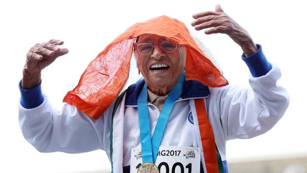 101-year-old Mann Kaur from India celebrates after competing in the 100m sprint in the 100+ age category at the World Masters Games at Trusts Arena in Auckland. Kaur clocked one minute 14 seconds as a small crowd cheered her on -- ending a mere 64.42 seconds off Usain Bolt’s 100m world record set in 2009. (Michael Bradley/AFP)