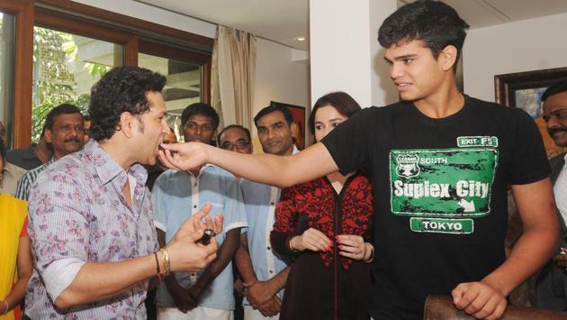 Sachin and his son Arjun at the celebrations in Mumbai. (Prakash Parsekar/HT PHOTO) 