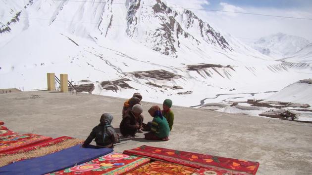 Children sun themselves on the roof of a house in Mudh village in Pin valley. (Amandeep Singh Kalra) 