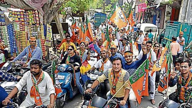 BJP workers during a bike rally on the last day of campaigning for the MCD elections in east Delhi on Friday. (Sonu Mehta/HT Photo) BJP workers during a bike rally on the last day of campaigning for the MCD elections in east Delhi on Friday. (Sonu Mehta/HT Photo)
