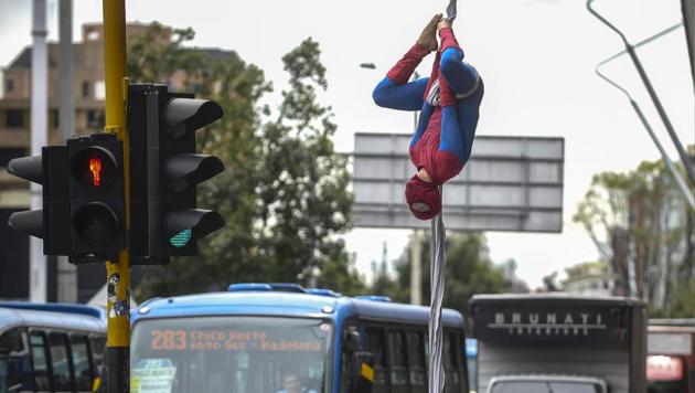 Colombian Jahn Fredy Duque, dressed as superhero ‘Spiderman’, performs on the streets in Bogota, Colombia. (Raul Arboleda / AFP)