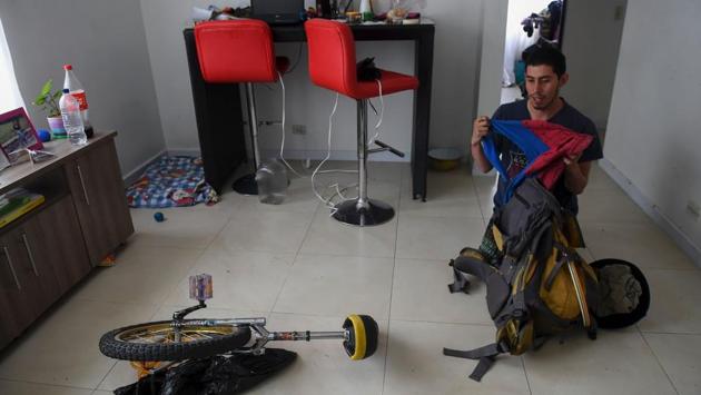Colombian Jahn Fredy Duque getting ready as superhero Spiderman. (Raul Arboleda / AFP)