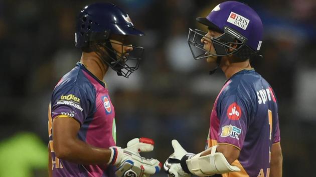 Rising Pune Supergiants cricketers Rahul Tripathi (L) and Ajinkya Rahane talk during their partnership. (AFP)