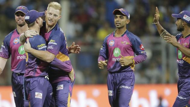 Rising Pune Supergiant players celebrate the wicket of Mumbai Indian Jos Buttler. (AP)