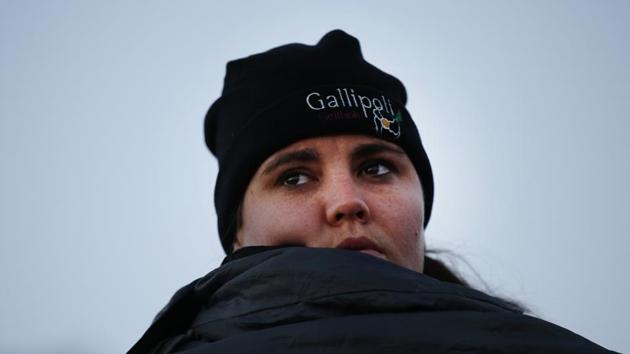 A woman watches the Dawn Service ceremony at the Anzac Cove beach in Gallipoli peninsula, Turkey. (Emrah Gurel/AP)
