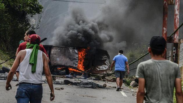 Venezuelan opposition activists set up barricades during a demonstration in San Cristobal. Elections for regional governors due in December have been postponed. Maduro said Sunday he wanted the regional elections “now” but did not indicate a possible date for those or local ballots that are due this year. (George Castellanos/AFP) Venezuelan opposition activists set up barricades during a demonstration in San Cristobal. Elections for regional governors due in December have been postponed. Maduro said Sunday he wanted the regional elections “now” but did not indicate a possible date for those or local ballots that are due this year. (George Castellanos/AFP)