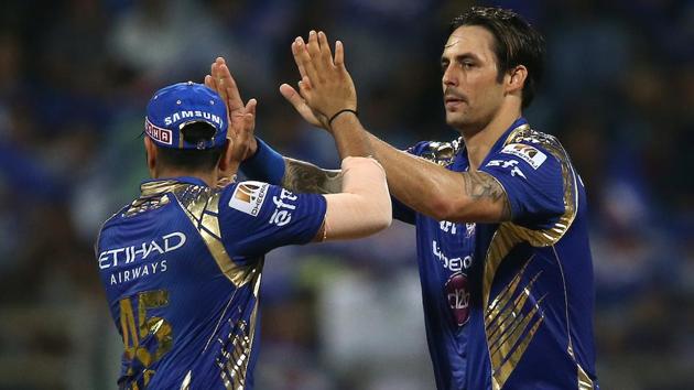 Mumbai Indians captain Rohit Sharma congratulates Mitchell Johnson after the dismissal of Ben Stokes. (BCCI)