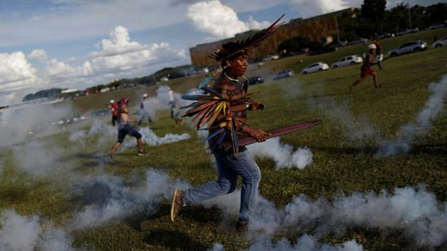 A police spokesman said the marchers went beyond the agreed point and invaded congressional grounds, requiring the use of force to keep them from entering the building. (Ueslei Marcelino/REUTERS)