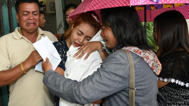 Jiranuch Trirat (centre) holds up the body of her 11-month-old daughter who was killed by her father, at a hospital in Phuket. (Reuters Photo) Jiranuch Trirat (centre) holds up the body of her 11-month-old daughter who was killed by her father, at a hospital in Phuket. (Reuters Photo)