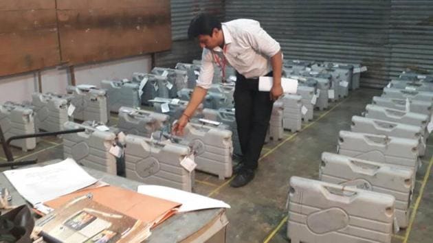 A personnel checks EVM machines at a polling centre at ITI Khichripur. Maoists killed 25 paramilitary personnel and injured six in Chhattisgarh’s south Sukma region on Monday, in the worst attack on security forces in the state in seven years. (Sushil Kumar/HT Photo)