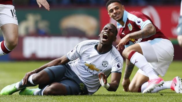 Manchester United's Paul Pogba is fouled by Burnley's Andre Gray during a Premier League match on April 23. (REUTERS) Manchester United's Paul Pogba is fouled by Burnley's Andre Gray during a Premier League match on April 23. (REUTERS)