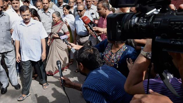 Delhi CM Arvind Kejriwal exit a polling booth after casting his vote in New Delhi.(PTI)