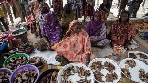 Women sell fish at a market in the town of Damasak . (Florian Plaucheur / AFP)