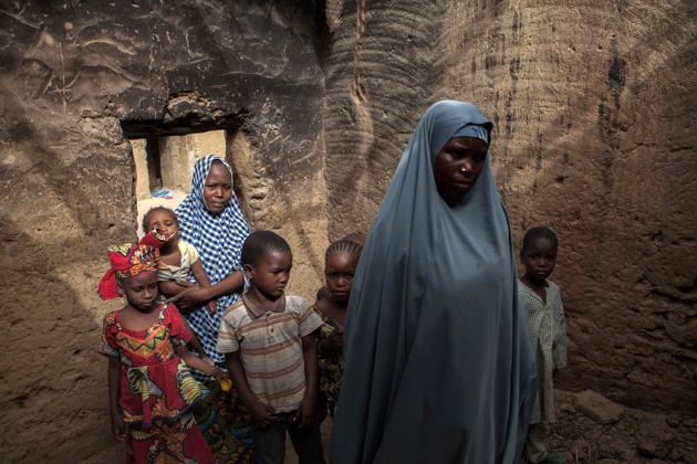 Yagana Bukar and her mother (R), whose two children have been kidnapped by Boko Haram insurgents, are seen at the family home in the town of Damasak in North East Nigeria . Yagana Bukar's younger brothers Mohammed and Sadiq were among about 300 children kidnapped by Boko Haram from the town of Damasak in remote northeastern Nigeria nearly three years ago who have returned to their homes. (Florian Plaucheur / AFP)