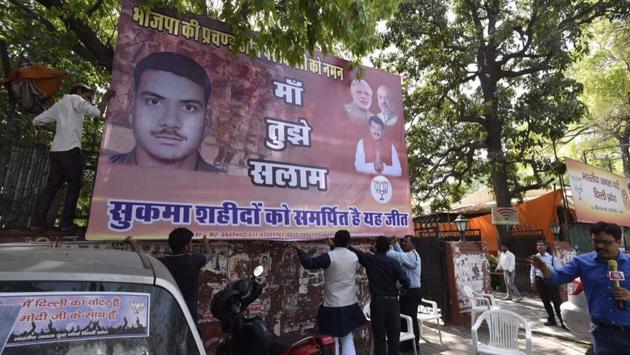 The party also put up a poster outside the BJP headquarters dedicating the win to the slain CRPF jawans. (Raj K Raj/HT Photo)