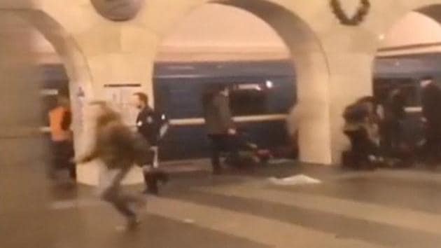 A still image shows a man running past blast victims lying on a platform at the metro station in St. Petersburg on April 3. (REUTERS)