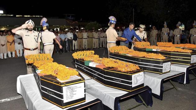 CRPF officers pay tributes to slain jawans who were killed in a Maoist attack in Chhattisgarh's Sukma district.(PTI File Photo)
