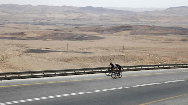 The tour began on Monday in the Jordanian capital Amman, with the cyclists set to reach Jerusalem on Friday after having crossed southern Israel and part of the occupied West Bank. (MENAHEM KAHANA / AFP)