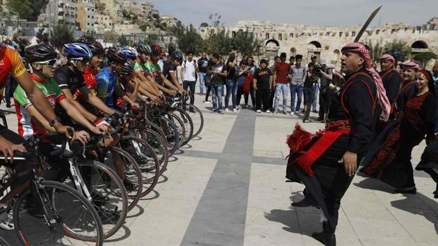 A group of cyclists have embarked on a multi-day tour in Jordan, Israel and the Palestinian territories as part of an effort to promote peace in the Middle East. (MENAHEM KAHANA / AFP)