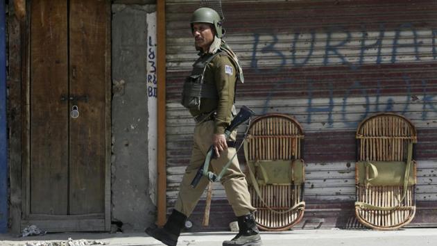 File photo of a paramilitary soldier patrolling in Srinagar.(AP File Photo)