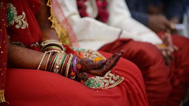 An Indian bride whose hands have been decorated with henna.(AFP File Photo/ Representative image)