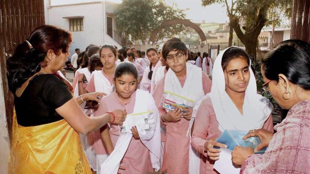 Teachers check students as they arrive to give their high school exam in Allahabad.(File Photo) Teachers check students as they arrive to give their high school exam in Allahabad.(File Photo)