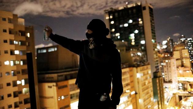 The mayor has called the move to repaint the busy avenue and insists that his fight is not with the city’s colorful street art but with a style of aggressive tagging known as ‘pichação.’ (Nacho Doce / REUTERS)