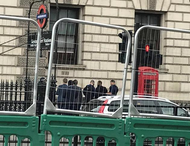 A man is held by police in Westminster after an arrest was made on Whitehall in central London on Thursday. (Reuters) A man is held by police in Westminster after an arrest was made on Whitehall in central London on Thursday. (Reuters)