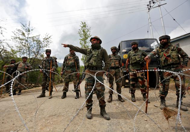 File photograph of soldiers outside a base in Kashmir's Kupwara district. l (REUTERS) File photograph of soldiers outside a base in Kashmir's Kupwara district. l (REUTERS)