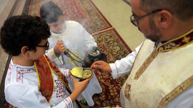 A priest burns incense during Sunday Mass at Saint Mary's church in the Egyptian capital Cairo on April 23, 2017, ahead of Pope Francis' visit. (MOHAMED EL-SHAHED/AFP)