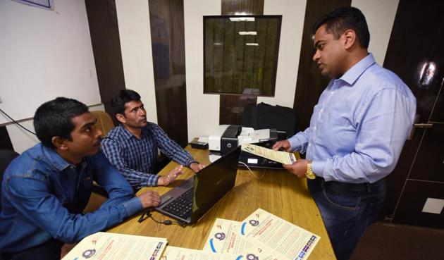 An industrialist getting assistance at the helpline centre opened by the Central Excise department for migrating to GST at Noida Entrepreneurs Association office. (Virendra Singh Gosain/HT PHOTO) An industrialist getting assistance at the helpline centre opened by the Central Excise department for migrating to GST at Noida Entrepreneurs Association office. (Virendra Singh Gosain/HT PHOTO)