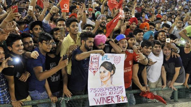 Fans enjoying the IPL match between Kings XI Punjab and Sunrisers Hyderabad at PCA Stadium in Mohali on Friday night. One fan had purportedly written down his phone number for KXIP co-owner and cinestar Preity Zinta! (Ravi Kumar/HT)