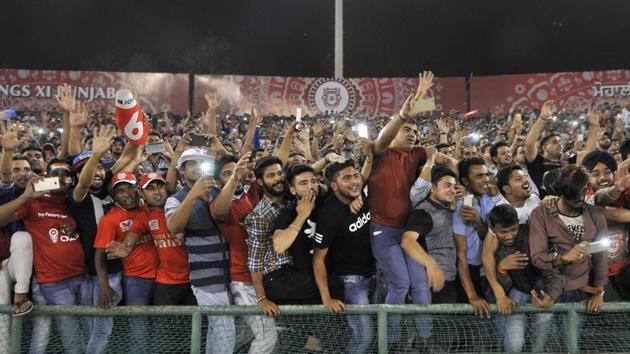 Fans enjoying the IPL match between Kings XI Punjab and Sunrisers Hyderabad at PCA Stadium in Mohali on Friday night. (Ravi Kumar/HT)