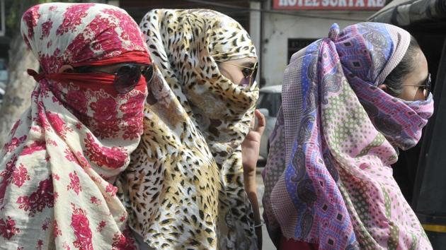 COVER UP: And when all else fails, all you can do is cover up and face the sun! (Gurminder Singh/HT )