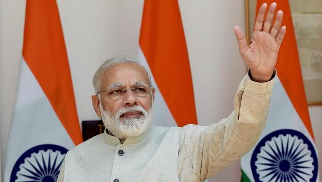 Prime Minister Narendra Modi greets the media in New Delhi on Wednesday. Karnataka, where the BJP came to power on its own for the first time in 2008, is the state from where the party is hoping to launch its battle for south India.(PTI)