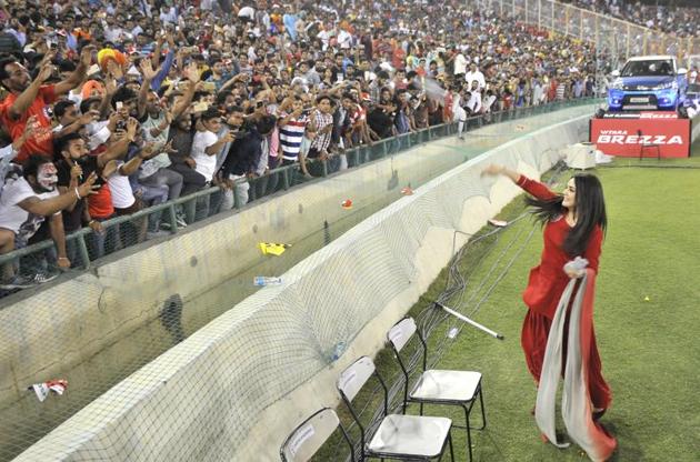 KXIP co-owner and cinestar Preity Zinta throws goodies to fans during the IPL match. (Ravi Kumar/HT)