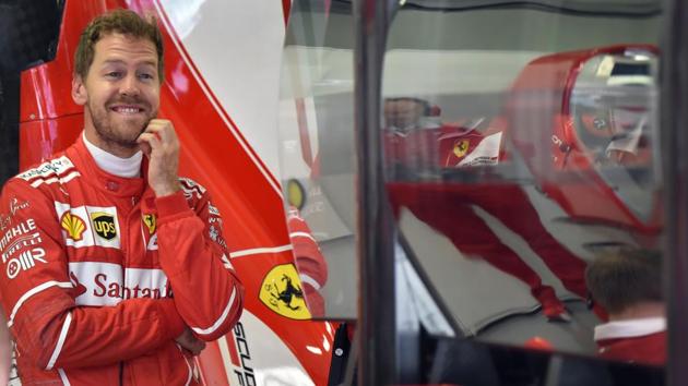 Ferrari's Sebastian Vettel stands in the garage during the practice session of the Russian Grand Prix. (AFP) Ferrari's Sebastian Vettel stands in the garage during the practice session of the Russian Grand Prix. (AFP)