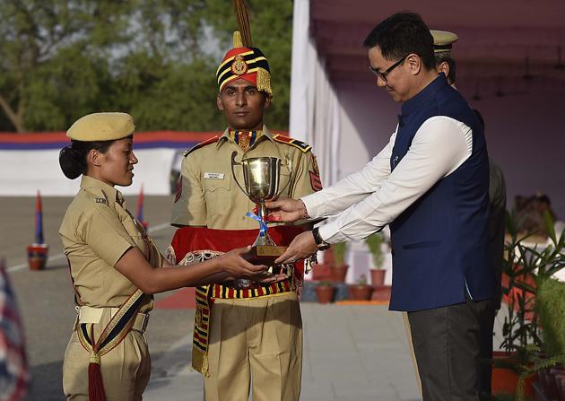 Rijiju giving away the best all-round trophy to C. Thele. The Passing out Parade of 107th (Male) and 108th (Female) batches of Recruit Constables was held at Police Training College, Jharoda Kalan. The parade was attended by Union Minister of State for Home Affairs Kiren Rijiju. (Raj K Raj/HT PHOTO)