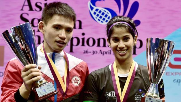 India's Joshna Chinappa and Hong Kong's Max Lee (L) pose with their trophies after the 19th Asian Squash Championships in Chennai on Sunday.(PTI)