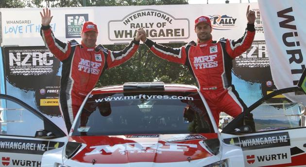 Gaurav Gill and co-driver Stephane Prevot (Belgium) of Team MRF Tyres celebrate at the podium of the International Rally of Whangarei in New Zealand on Sunday.(HT Photo)