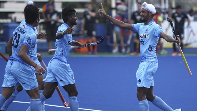 Mandeep Singh (right) celebrates with teammates after scoring Indian hockey team’s opening goal against New Zealand at the Sultan Azlan Shah Cup in Ipoh, Malaysia, on Sunday. (Hockey India) Mandeep Singh (right) celebrates with teammates after scoring Indian hockey team’s opening goal against New Zealand at the Sultan Azlan Shah Cup in Ipoh, Malaysia, on Sunday. (Hockey India)