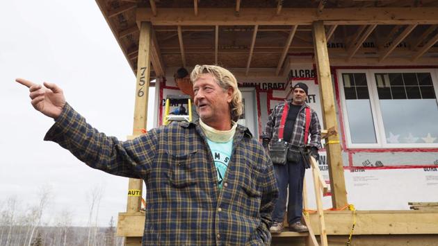 Homeowner Steven Menard speaks outside his residence that he is rebuilding with his own hands after it was destroyed one year ago in the fire. Menard arrived in Fort McMurray as a teenager four decades ago. Little remains of the Abasand neighborhood where his house once stood. Menard says, he still cries every day, confessing that he worries his nightmarish memories of the wildfires will forever haunt him. But , Fort McMurray needs builders, not whiners, he adds. (Robyn Beck/AFP) Homeowner Steven Menard speaks outside his residence that he is rebuilding with his own hands after it was destroyed one year ago in the fire. Menard arrived in Fort McMurray as a teenager four decades ago. Little remains of the Abasand neighborhood where his house once stood. Menard says, he still cries every day, confessing that he worries his nightmarish memories of the wildfires will forever haunt him. But , Fort McMurray needs builders, not whiners, he adds. (Robyn Beck/AFP)