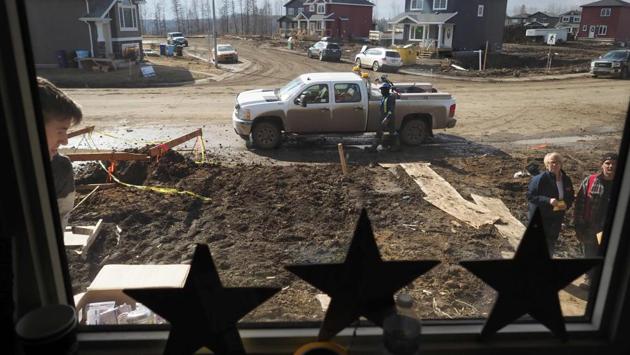 A view from inside the home of Steve Menard as he and his neighbours rebuild. All around in the hard-hit Waterways district there are vacant lots that have been cleared of debris. Eight out of 10 homes here were destroyed in the fire. (Robyn Beck/AFP) A view from inside the home of Steve Menard as he and his neighbours rebuild. All around in the hard-hit Waterways district there are vacant lots that have been cleared of debris. Eight out of 10 homes here were destroyed in the fire. (Robyn Beck/AFP)