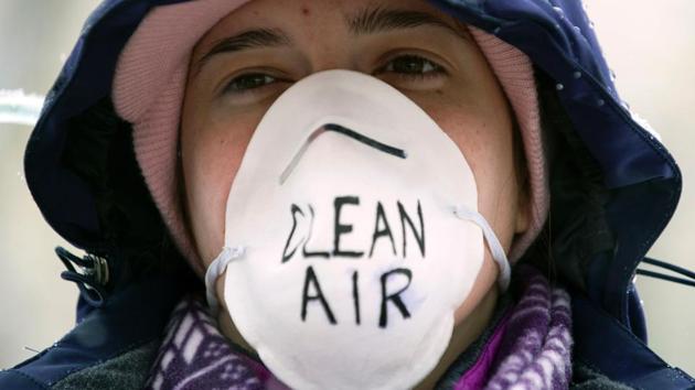 A demonstrator wears a air filtering mask while participating in the People's Climate March. Dozens of “sister” marches are planned for other North America locales, from Annapolis Royal, Nova Scotia, to Dutch Harbor in Alaska’s Aleutian Islands. (Jason Connolly/AFP)