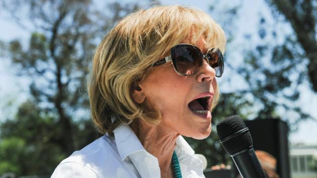 Actor and activist Jane Fonda speaks to the crowd. In his campaign, Trump called climate change a hoax. Last month he kept a promise to the coal industry by undoing climate-change rules put in place by Obama. (Andrew Cullen/REUTERS)