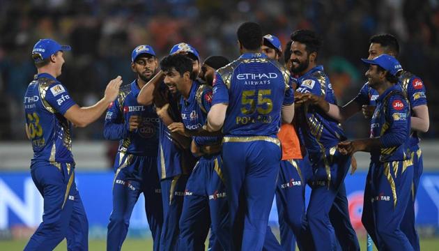 Mumbai Indians cricketers congratulate Jasprit Bumrah (centre) as they celebrate the Super Over victory against Gujarat Lions in their Indian Premier League match in Rajkot on Saturday.(AFP)