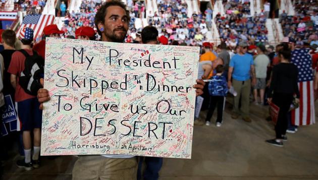 A man holds up a sign about the Washington Correspondents Dinner before a US President Donald Trump rally in Harrisburg, Pennsylvania, on April 29, 2017. (Reuters) A man holds up a sign about the Washington Correspondents Dinner before a US President Donald Trump rally in Harrisburg, Pennsylvania, on April 29, 2017. (Reuters)