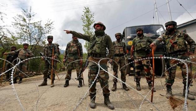 Army soldiers stand guard inside their army base after it was attacked by suspected separatist militants in Panzgam in Kashmir's Kupwara district. (Reuters) Army soldiers stand guard inside their army base after it was attacked by suspected separatist militants in Panzgam in Kashmir's Kupwara district. (Reuters)