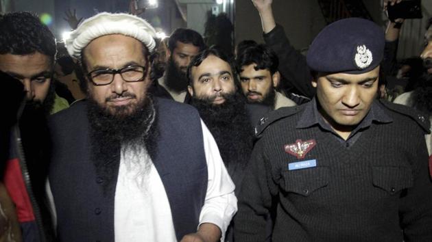 Hafiz Saeed (L) being escorted by a police official in Lahore, Pakistan.(AP File Photo) Hafiz Saeed (L) being escorted by a police official in Lahore, Pakistan.(AP File Photo)